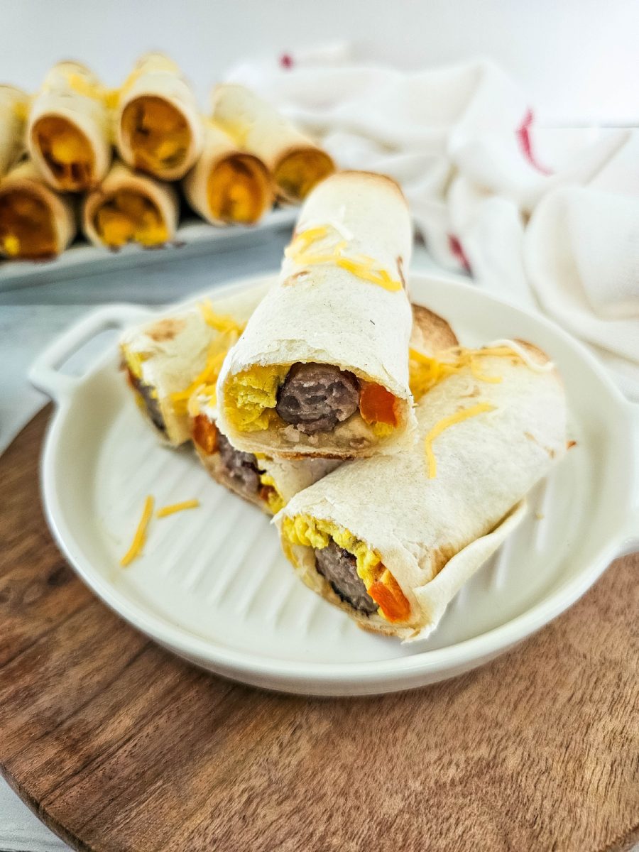 breakfast taquitos cut in half on plate
